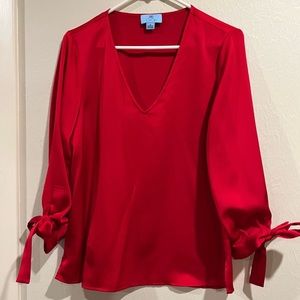 CeCe red V neck top. 3/4 length sleeve. Size medium.